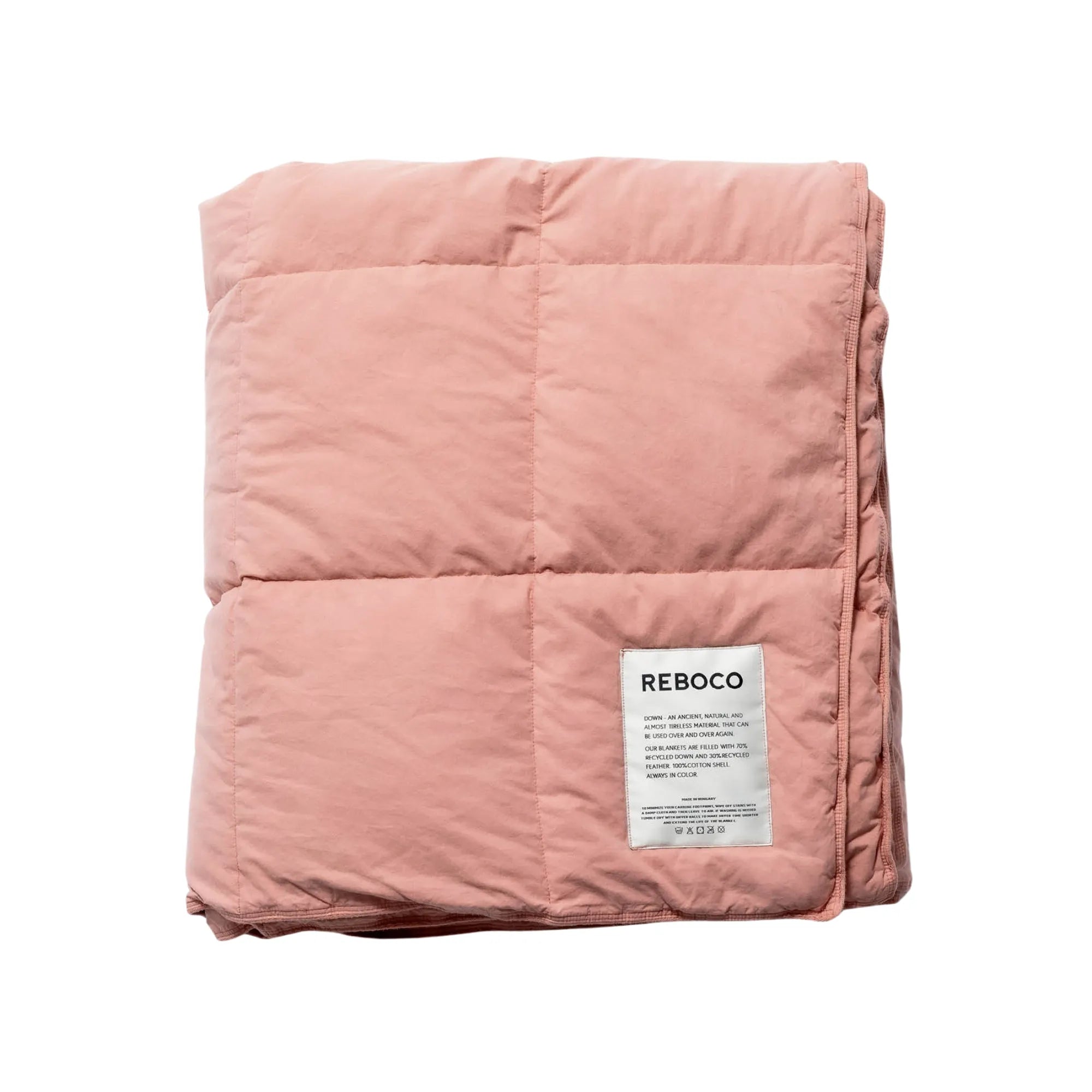 Soft and cozy faded rose down blanket with luxurious texture and warmth