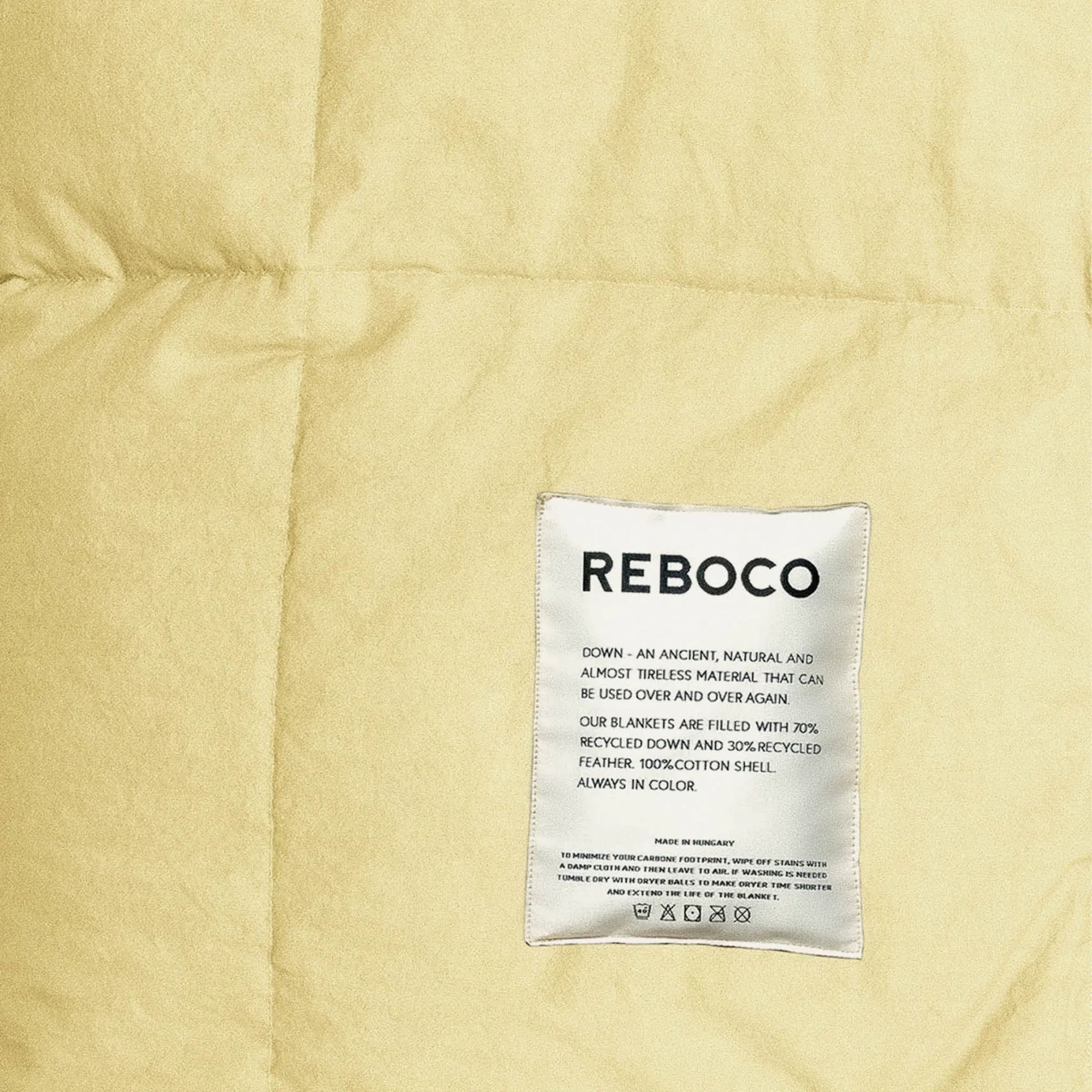 Soft and stylish, the Down Blanket - Pale Banana adds a touch of elegance to any bedroom décor