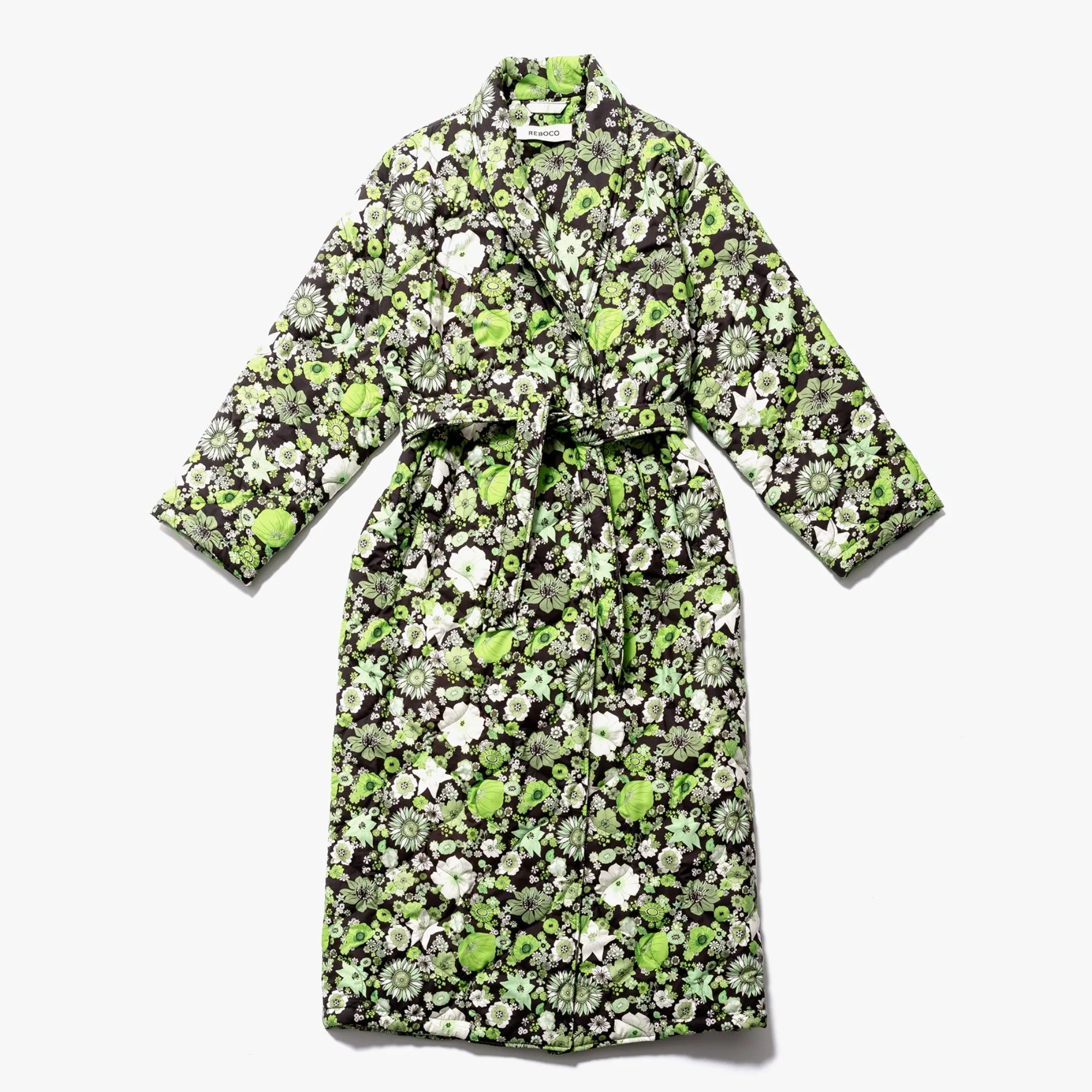 A stylish and elegant morning coat featuring a vibrant green color and a charming field of flowers design