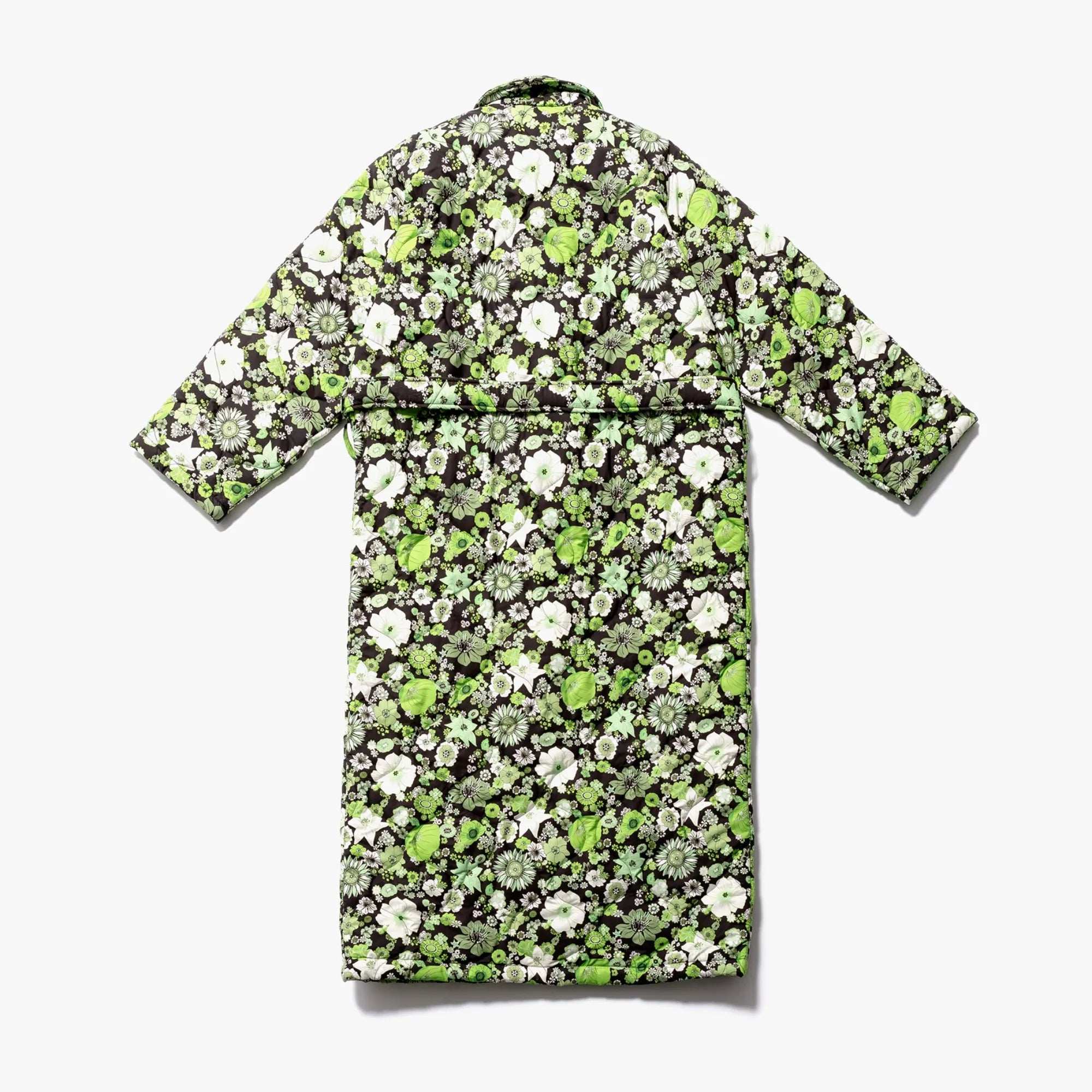 A classic morning coat adorned with a stunning green fields of flowers pattern and a timeless silhouette
###