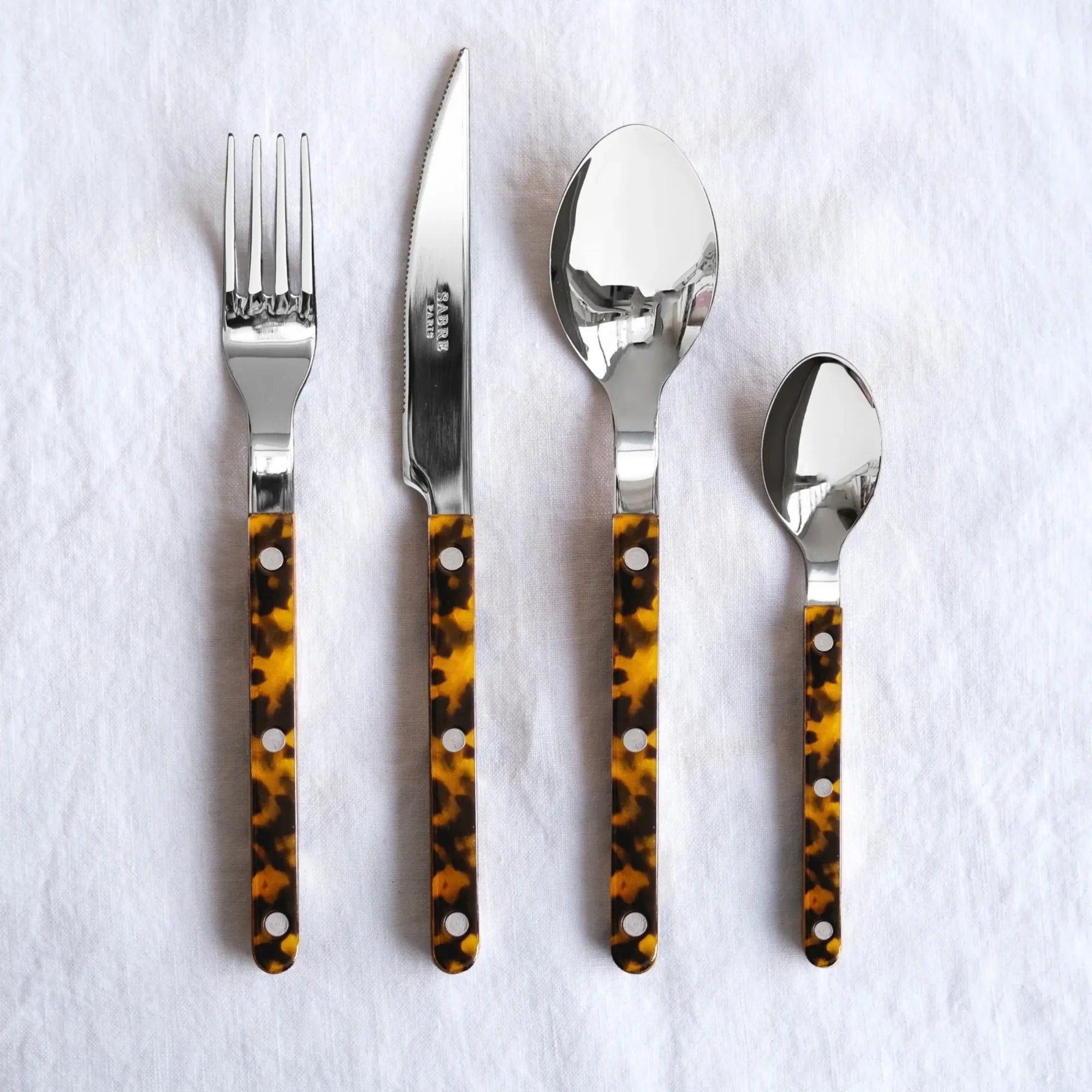 Beautiful and elegant Bistrot Tortoise Cutlery Set with stainless steel utensils and tortoiseshell-patterned handles for a sophisticated dining experience