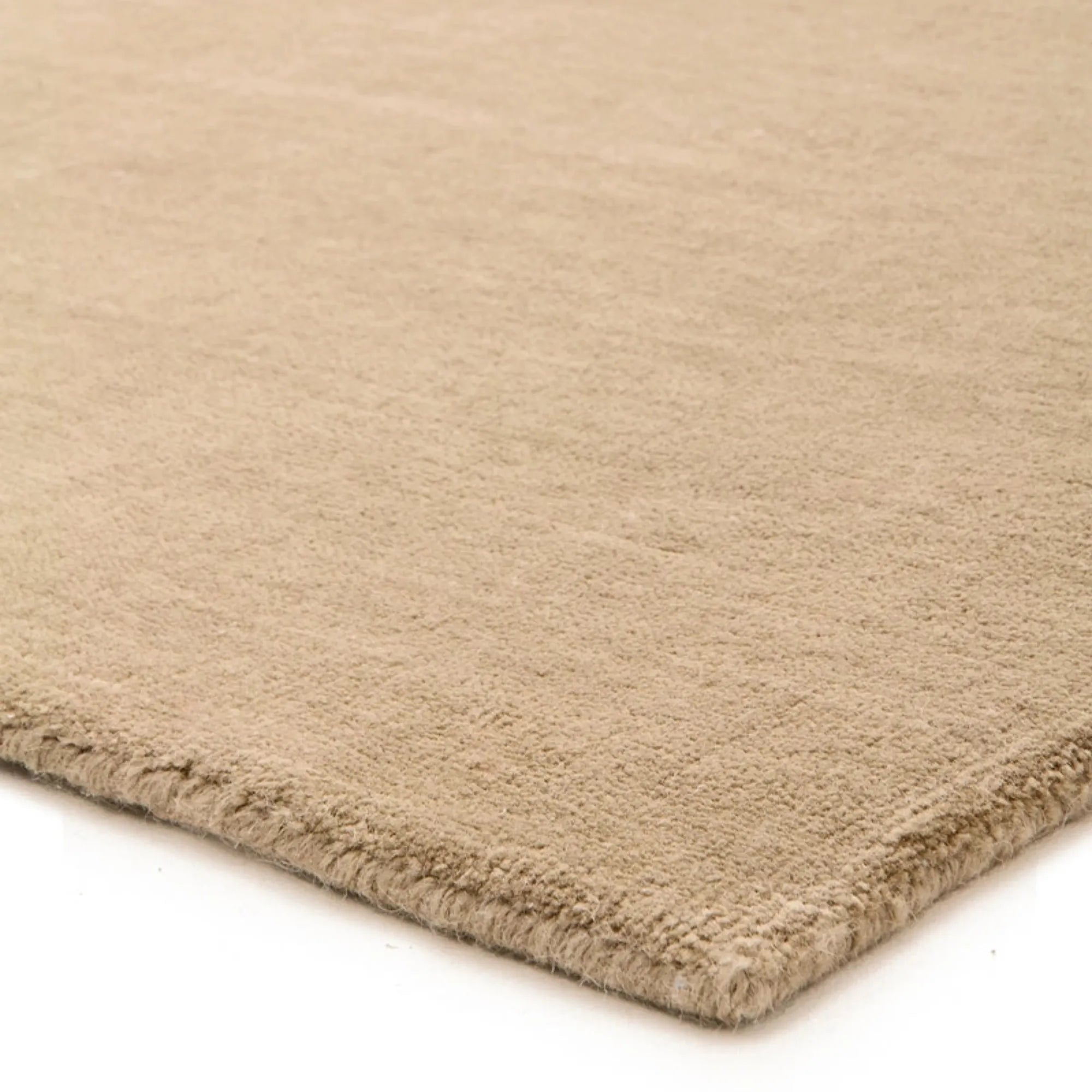 Hand-woven Sana Wool Rug in neutral tones, perfect for adding cozy texture to any room