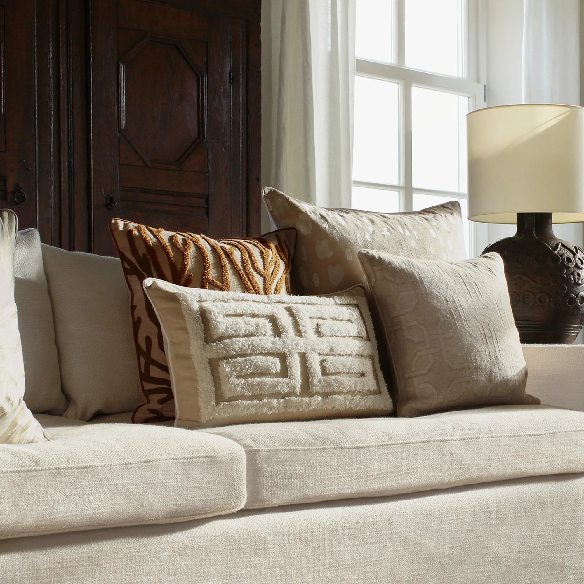 Cleo Cushion with a stylish fringe detail in a versatile cream color