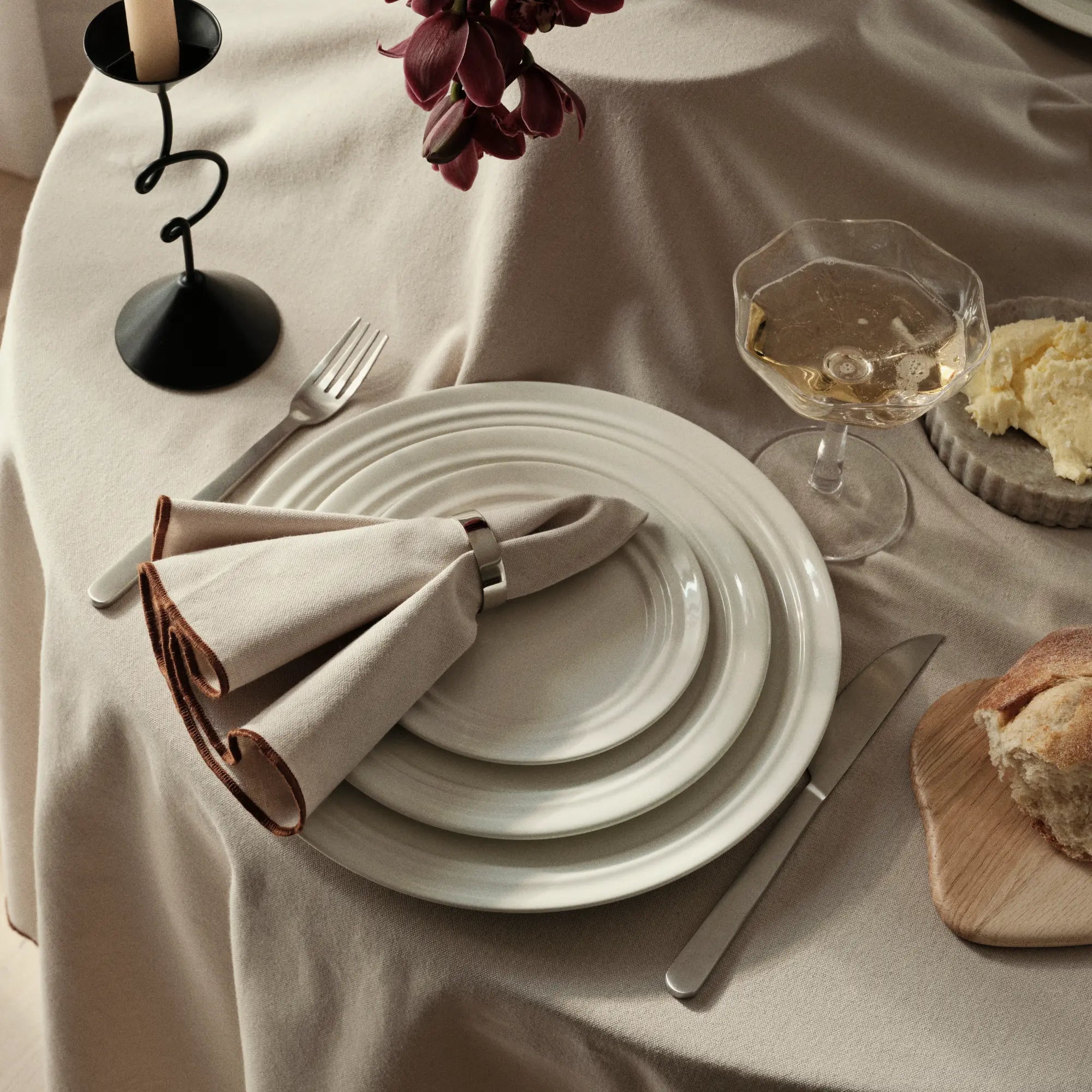  Four-piece dinnerware set includes dinner plates, salad plates, and soup bowls for a complete dining experience