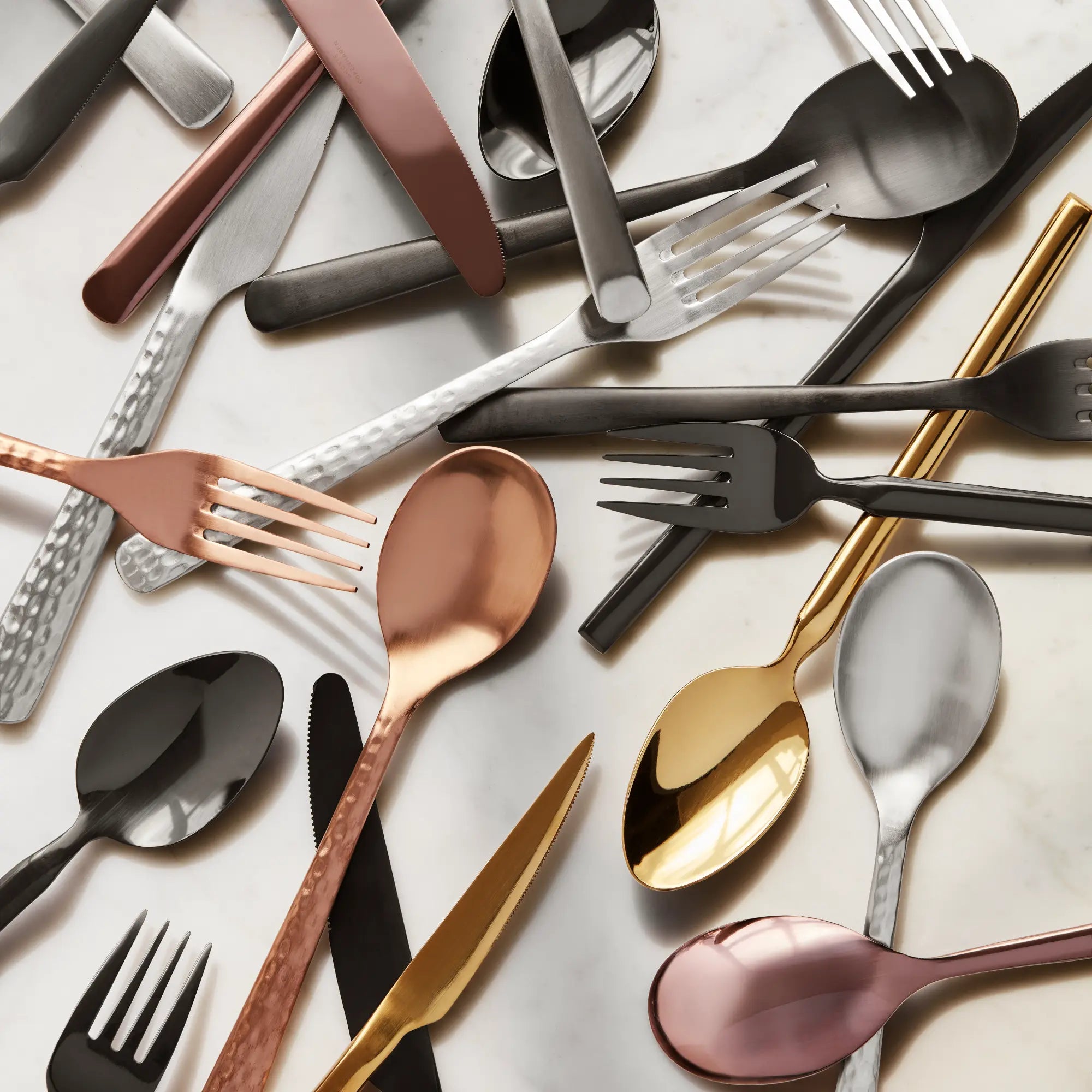 Luxurious and eye-catching Hune Hammered Cutlery Set featuring a complete set of utensils