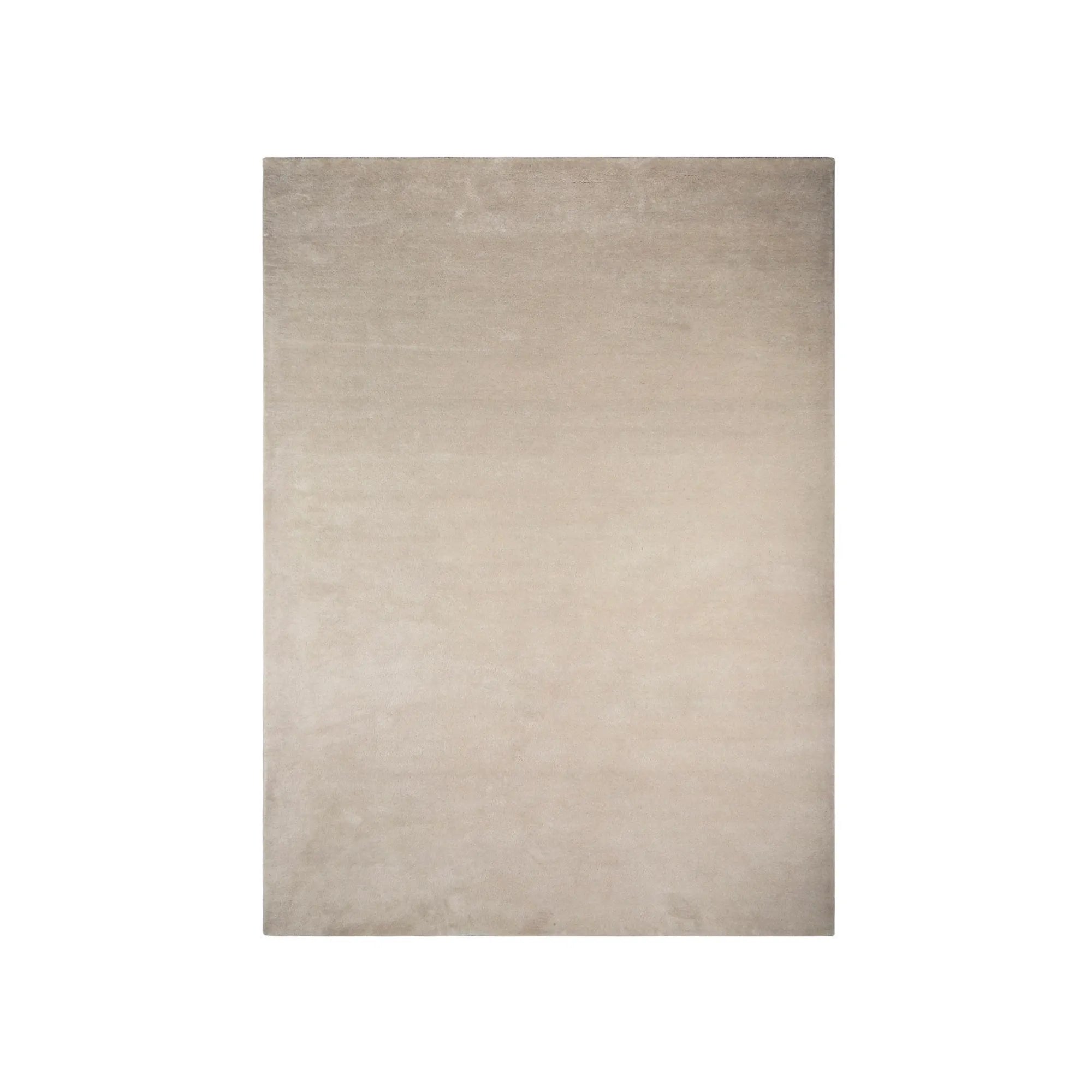 Large, plush beige RePeat Rug with intricate woven pattern and soft texture