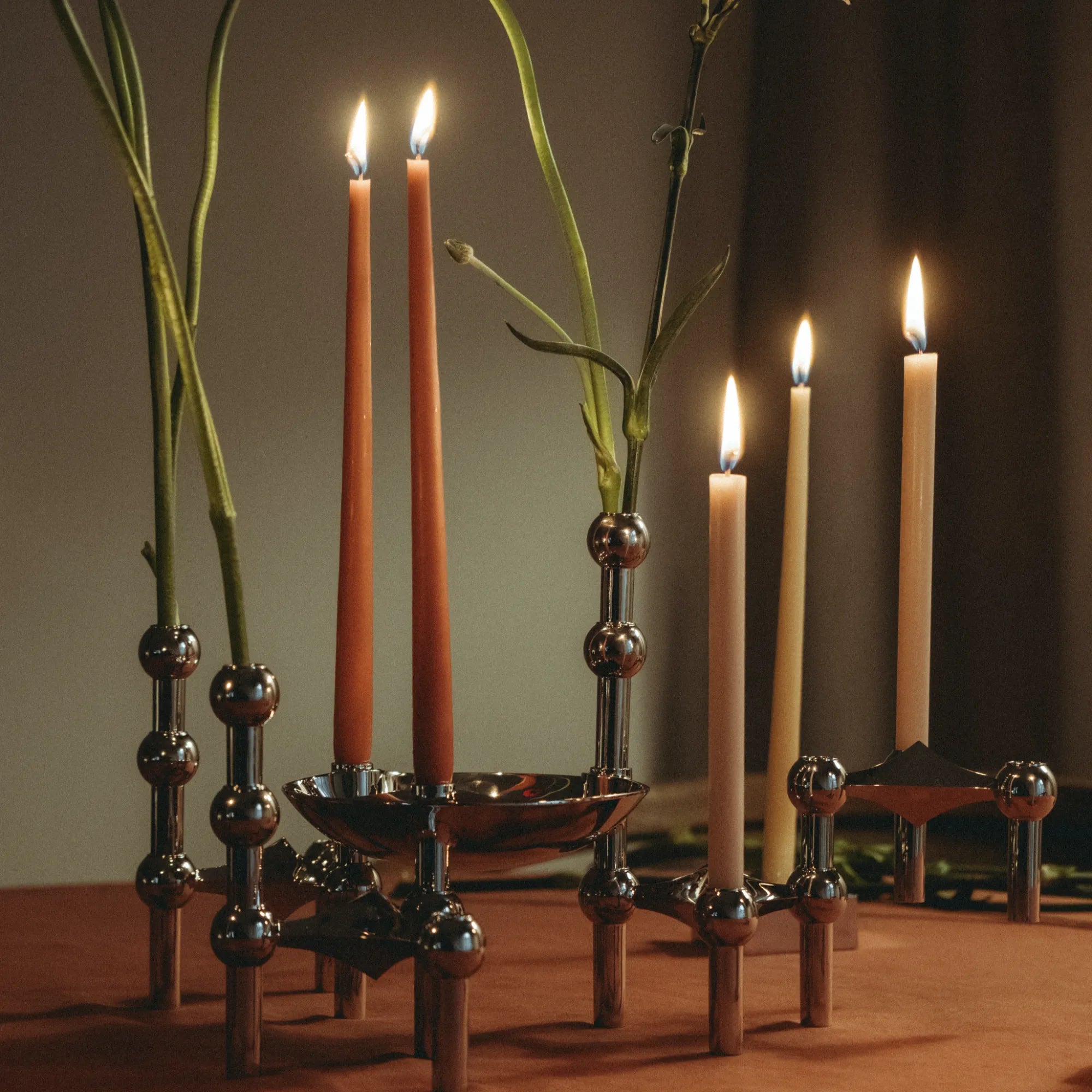 Elegant tall glass vase candle holder with silver base and intricate patterns