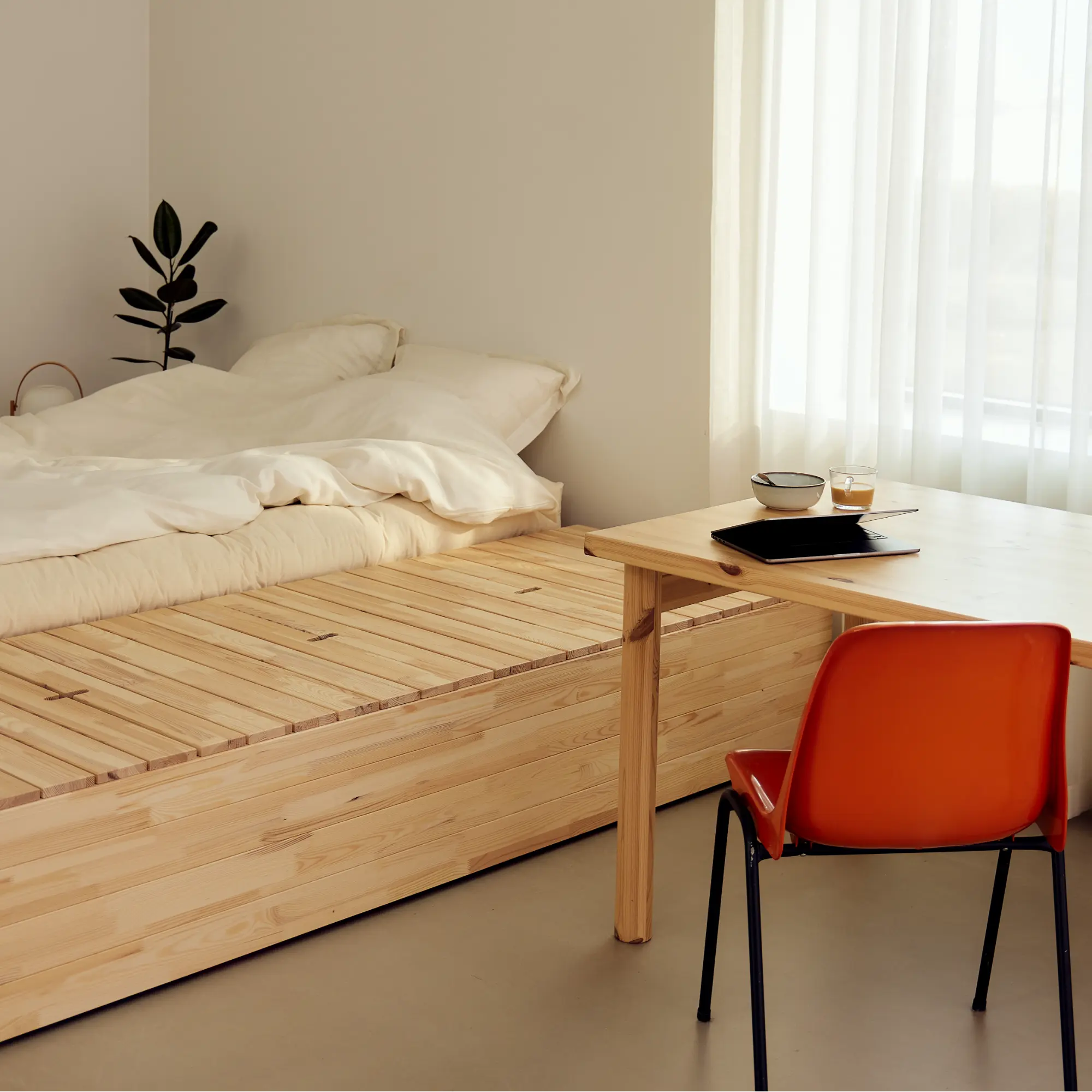 Cozy basement guest room with inviting bed and neutral decor