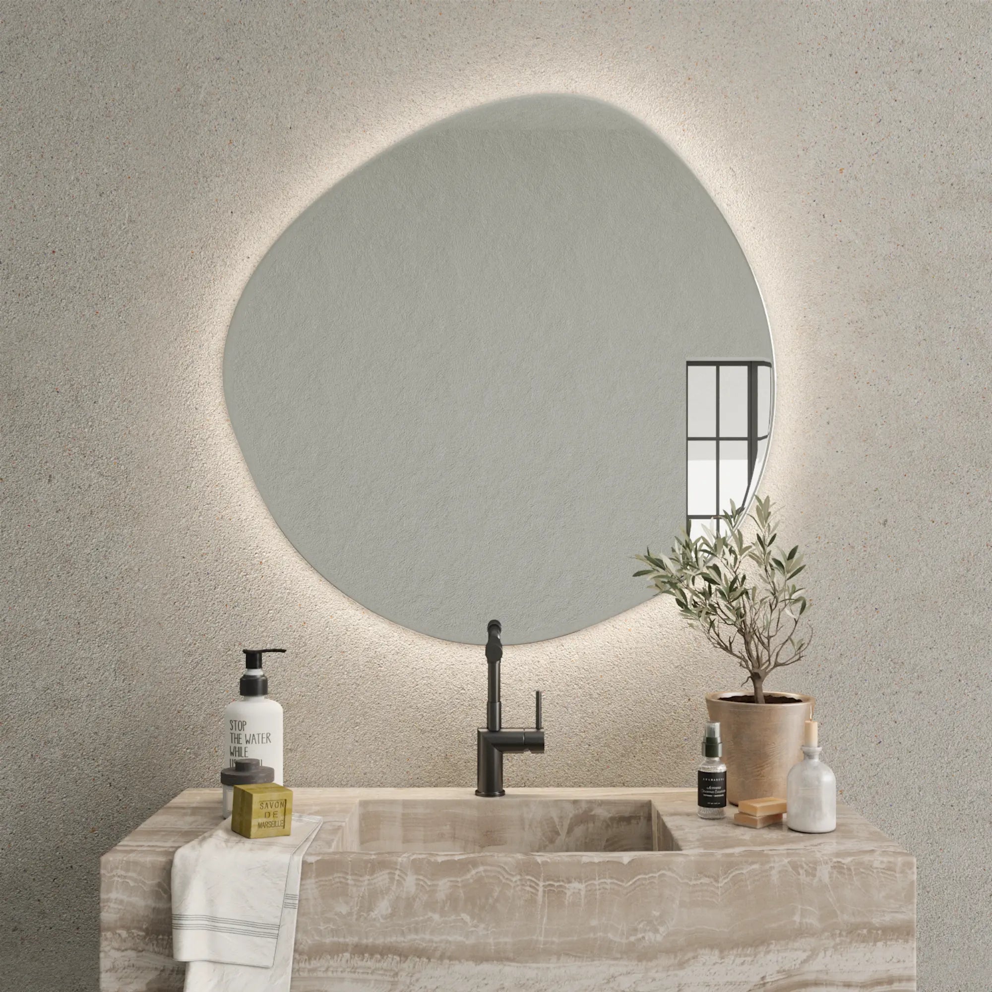 Pebble Mirror with Lights creating a warm and inviting atmosphere in cozy reading nook