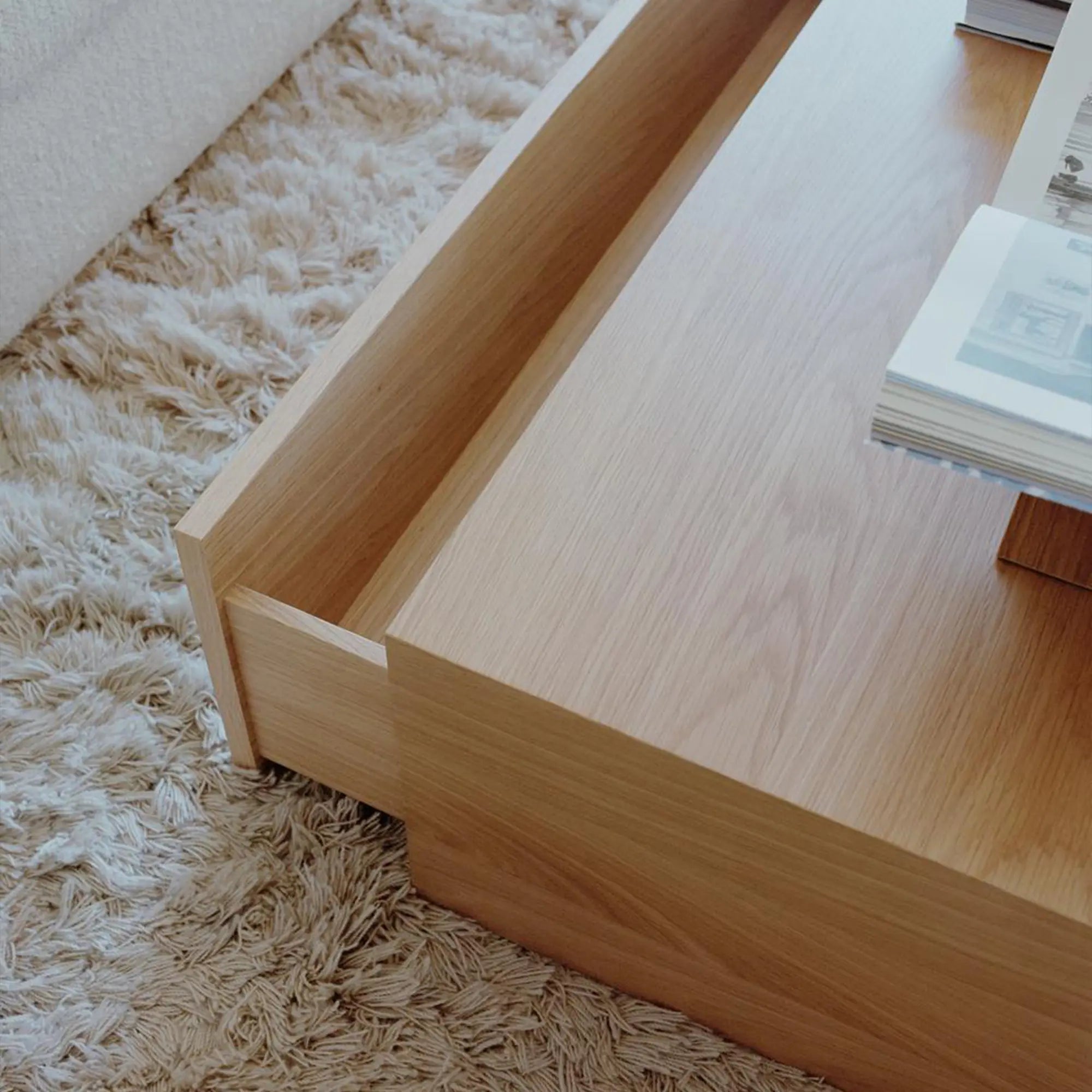  High coffee table with a deep drawer for storing books and remotes