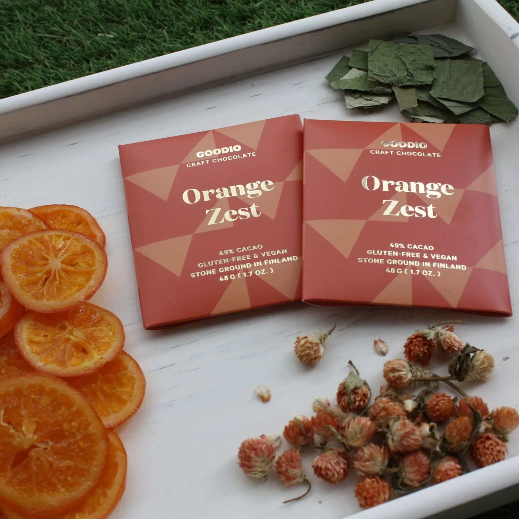 Delicious and indulgent Orange Zest Chocolate 49% with a rich and creamy texture, perfect for satisfying your sweet cravings