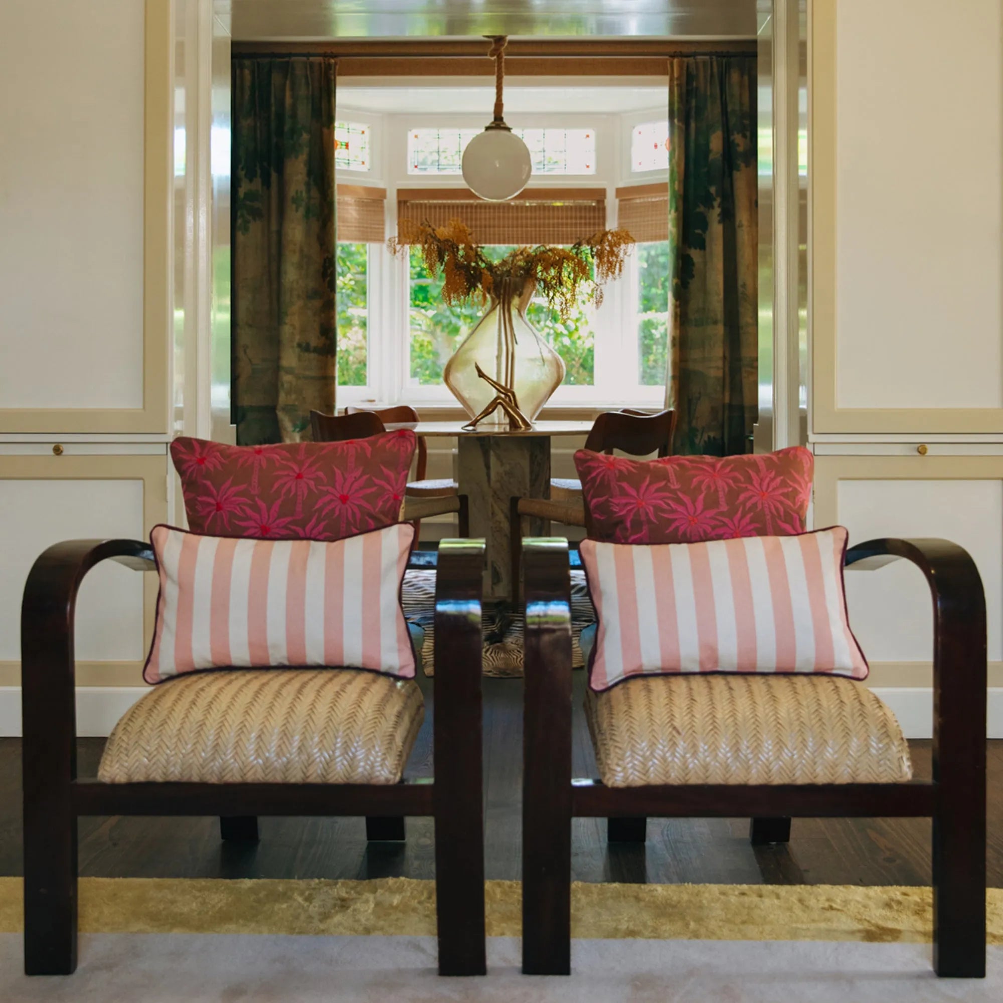  A pair of Laura Cushions in a bohemian-inspired interior with natural elements