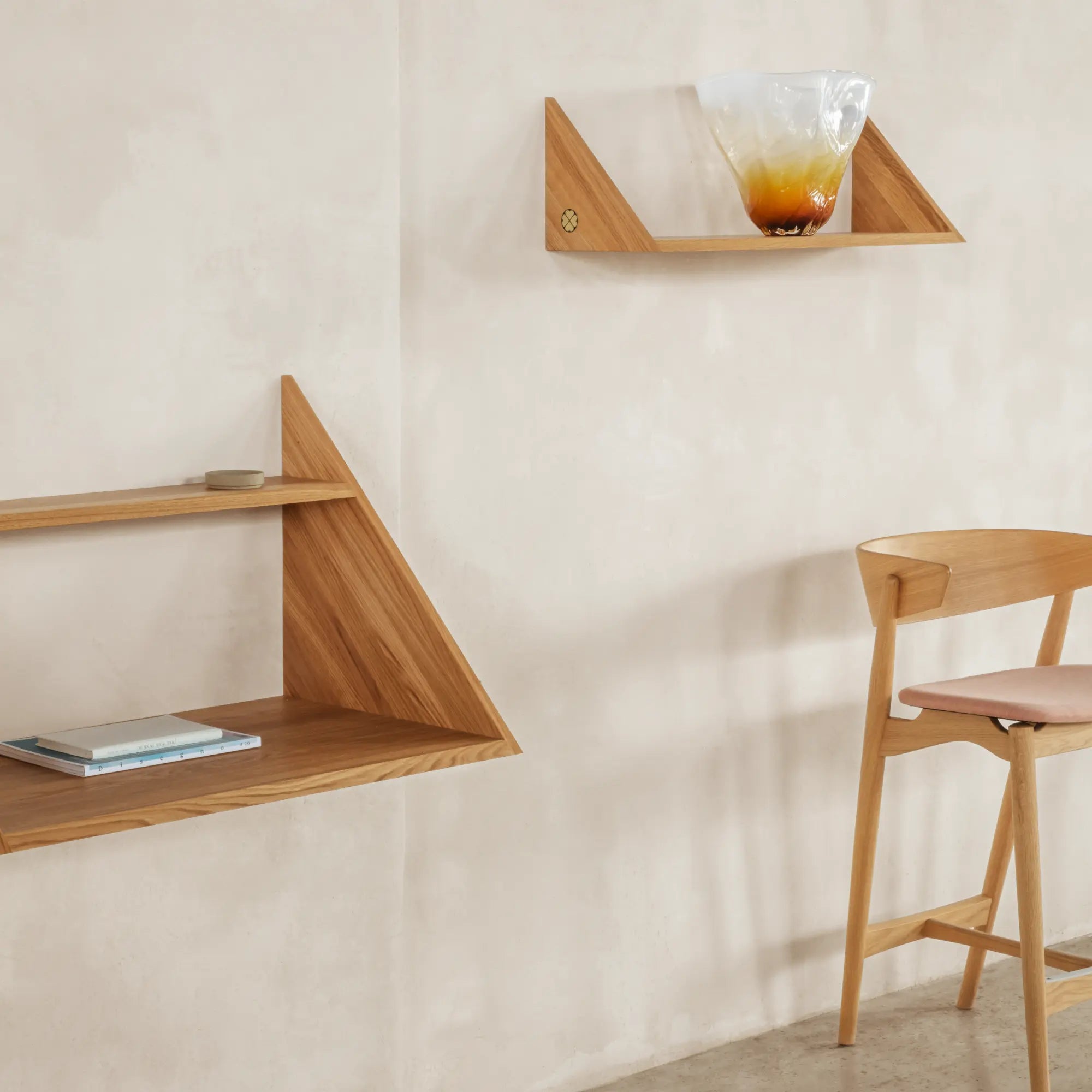 Close-up of the Xlibris Shelf's sturdy steel frame and stylish wood shelves