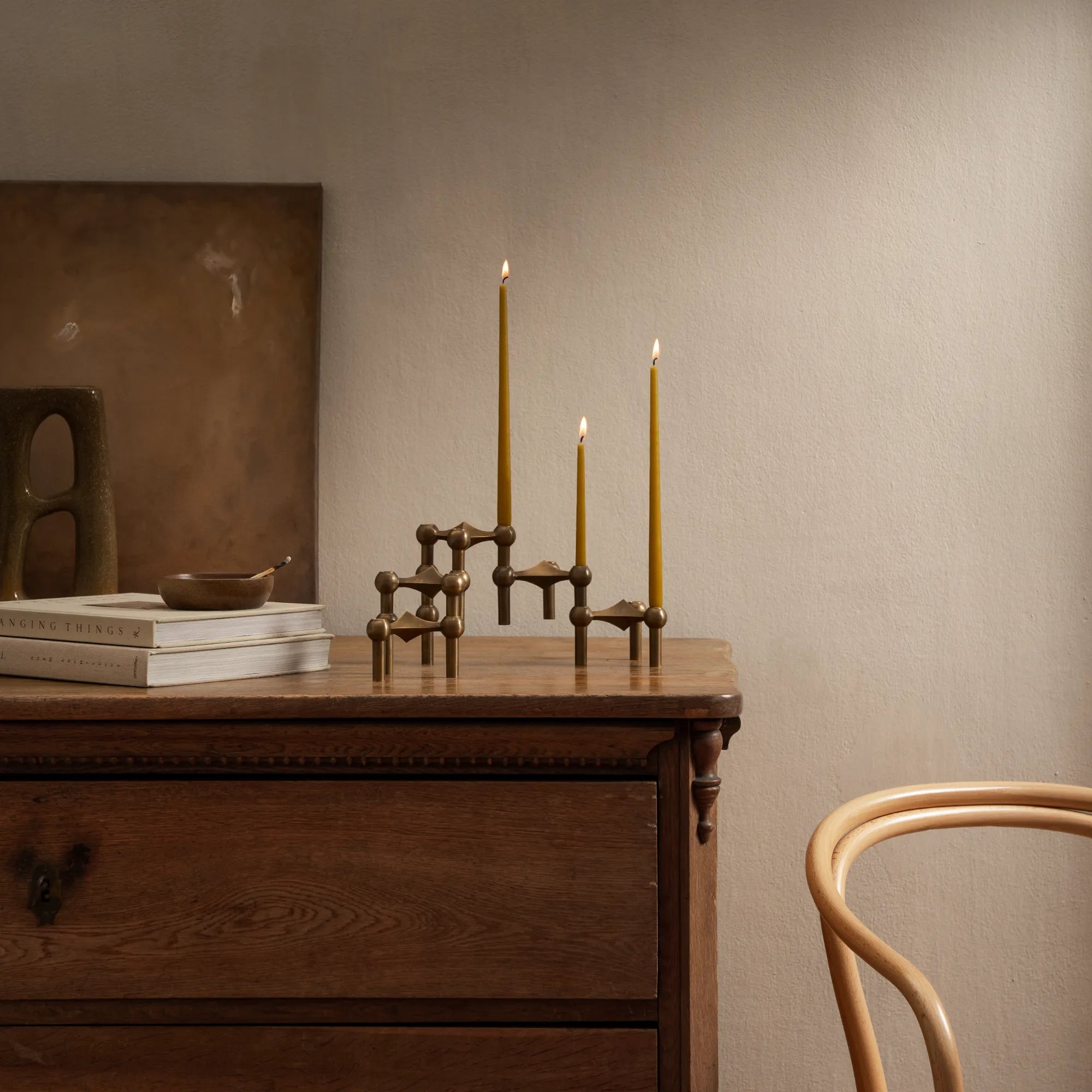 Elegant and versatile bronzed brass candle holder in a modular design