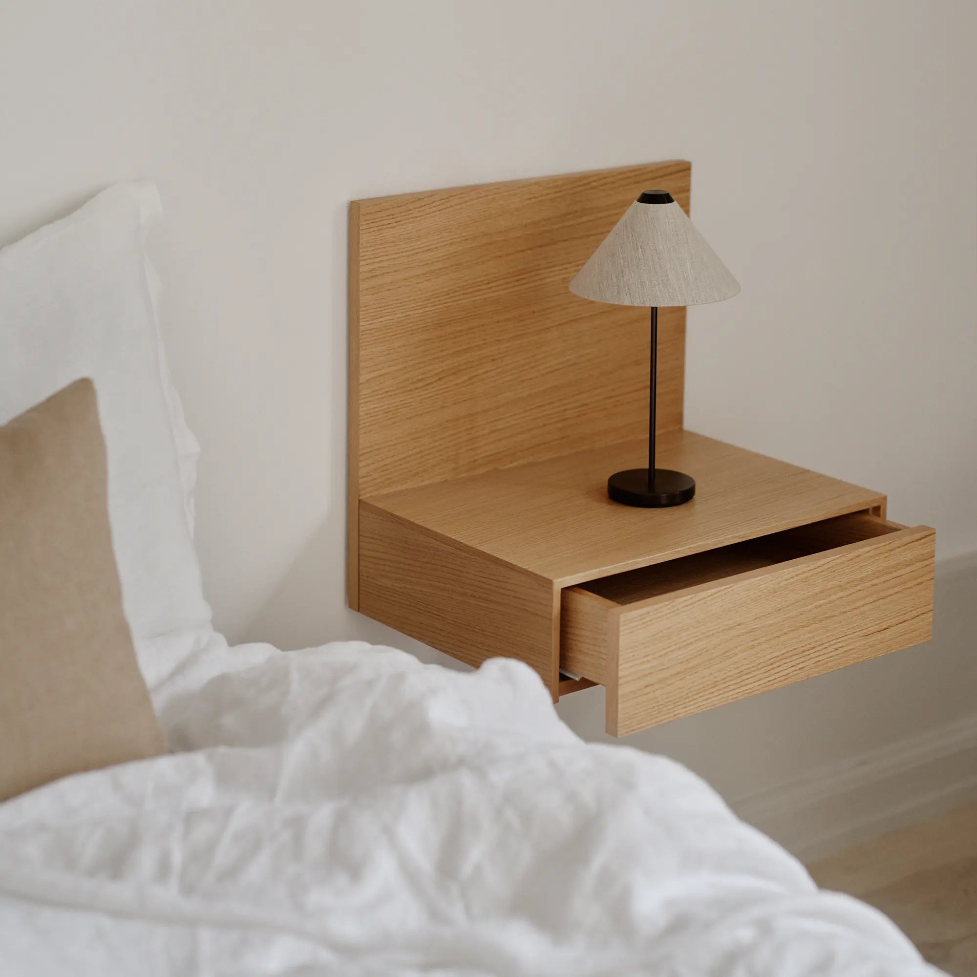 Modern and sleek Tana Wall Mounted Nightstand in natural wood grain