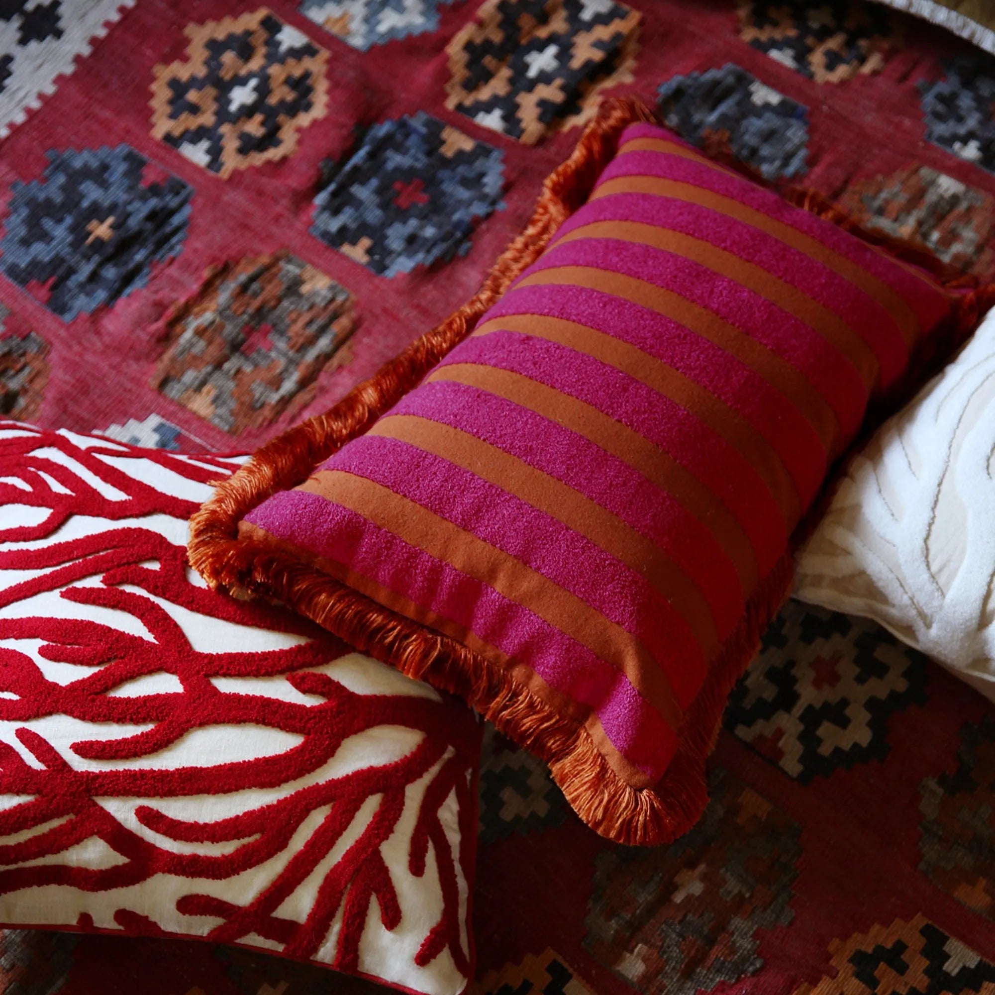 A close-up of the intricate stitching on the Audrey Cushion