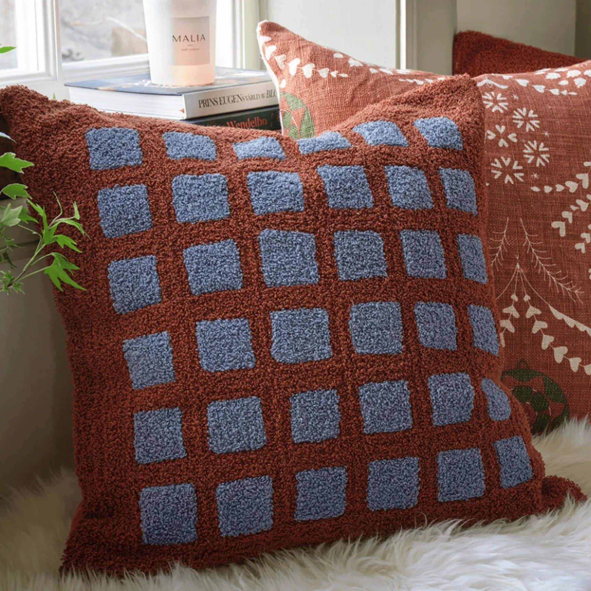 Soft and cozy Mohan Boucle Cushion in Terracotta and Dusty Blue