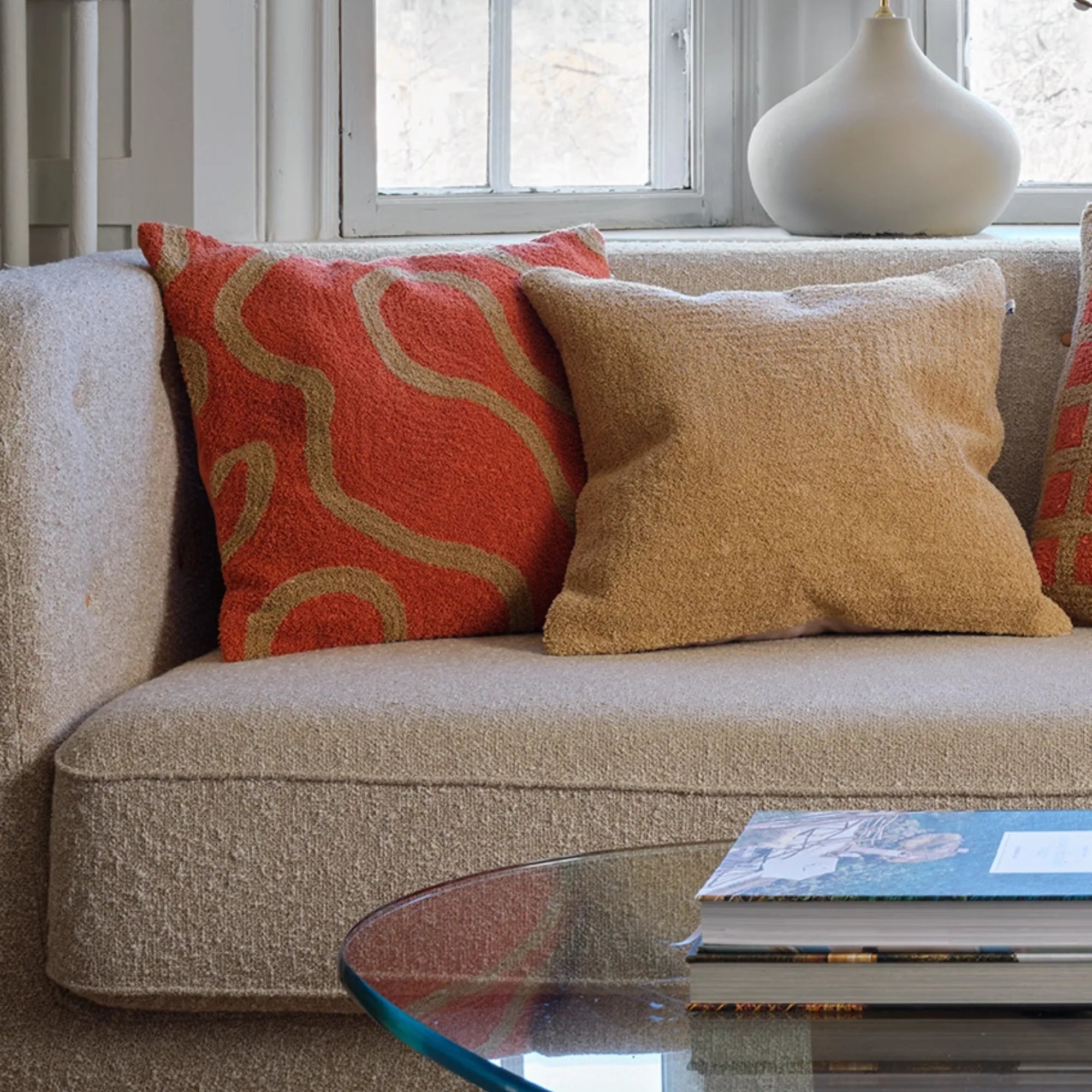 Luxurious Swati Boucle Cushion Pillow in warm hues of Apricot Orange and Sand, adding a pop of color to your home decor