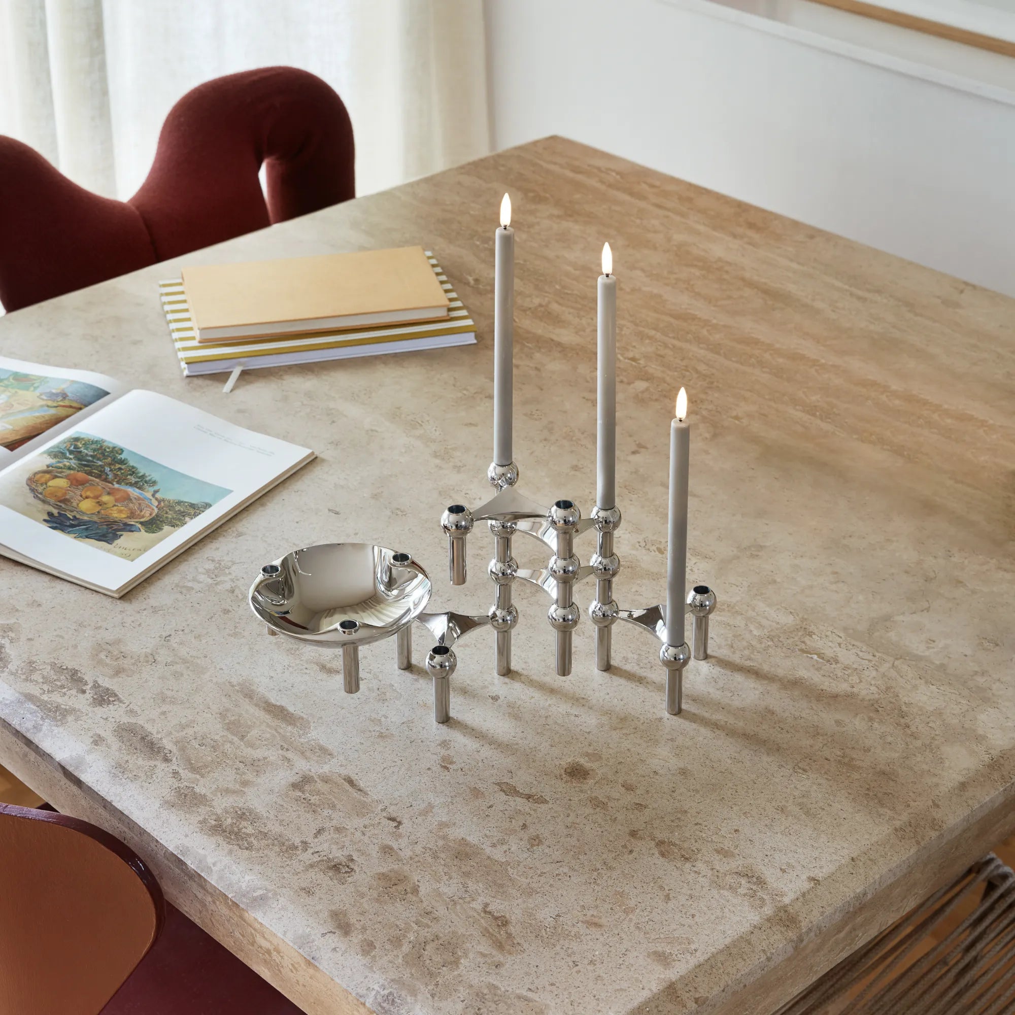 Modern modular candle holder in sleek chrome finish with unique configuration 7 design